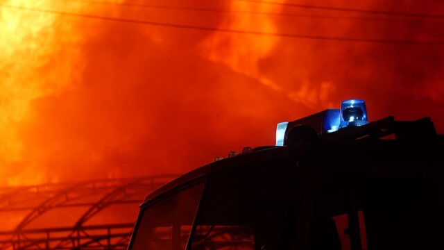 fire truck and flasher fire engine. fire on the roof of the house. a burning at building house . home insurance apartment concept. huge fire blazes houses 911. property damage night arson protection
