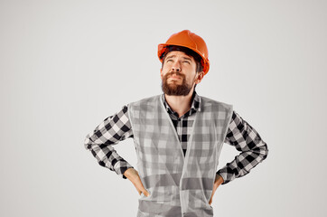 emotional man in working uniform construction building profession light background