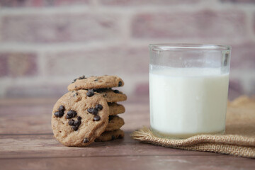 chocolate cooking and a glass of chocolate milkshake on table 