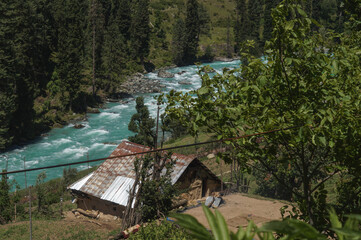 Old house by a river in kashmir