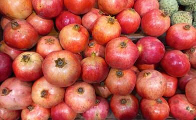 Pomegranate fruits. Fresh subtropical fruits for sale on farmers market