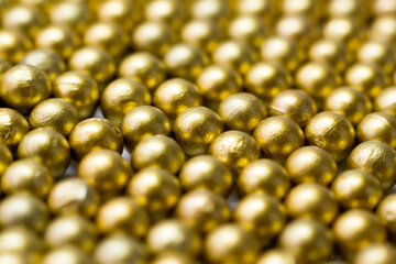 Golden balls, shiny beads so close