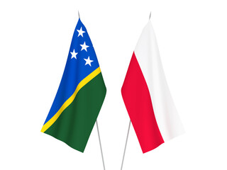 National fabric flags of Solomon Islands and Poland isolated on white background. 3d rendering illustration.