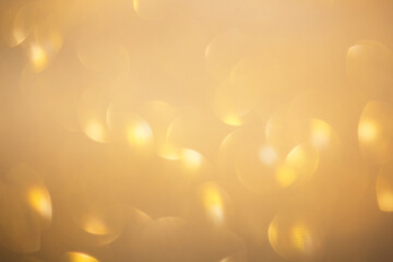 Glitter gold bokeh background for graphic design or wallpaper