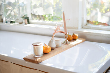 Rustic-style bathroom with large window. Candle stand.