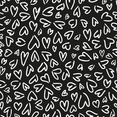 Random placed, monochrome vector love signs all over surface print on black background.