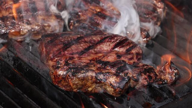 Searing and smoking ribeye steaks on grill