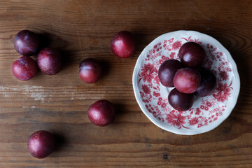 red plums on a plate