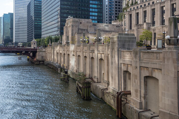 Vintage art deco wall along Chicago river in downtown setting on sunny day