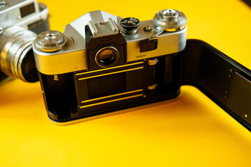 Vintage Photo Camera on yellow background