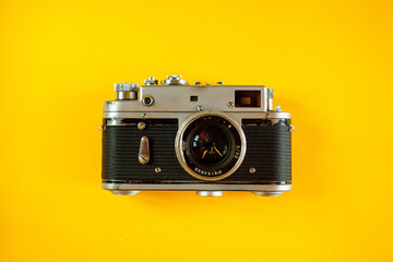 Vintage Photo Camera on yellow background