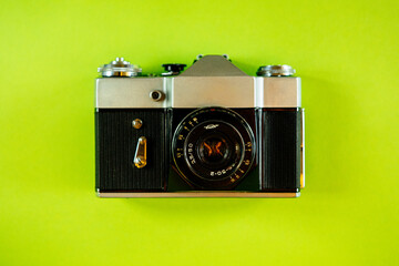 Vintage Photo Camera on green background