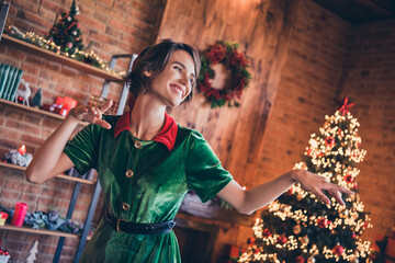 Portrait of attractive trendy dreamy cheerful girl elf dancing enjoying staying at home modern loft...