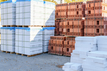 Building material on the outdoor market: ceramic bricks and aerated concrete blocks, gas blocks