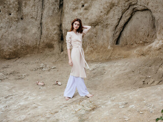 pretty woman near stone rocks lifestyle fashion