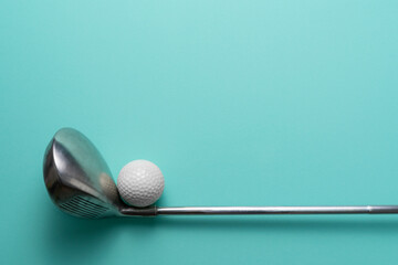 golf ball and golf club on green table background, flat lay,  sport concept