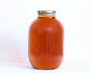 three liters of homemade beer in a glass jar