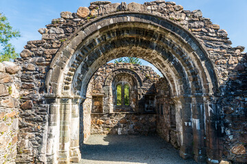 Fototapeta premium Ruins of the Glendalough Saint Saviour's Priory Choir Arch and Chancel in Wicklow, Ireland.