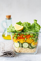 Glass box with fresh raw vegetable salad. Healthy Meal recipe preparation. Healthy vegan dishes in glass container. Vegetarian cuisine. Plant-based dishes. Green living concept. Organic food.