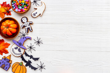 Funny halloween cookies and sweets flat lay, top view