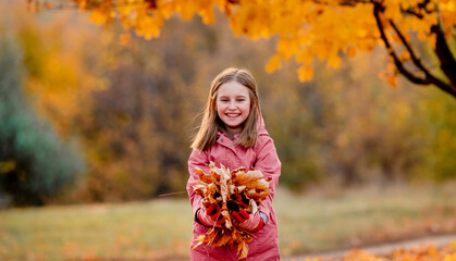 Preteen girl kid at autumn park