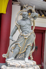 the Nio statue,  one of two wrathful and muscular guardians of the Buddha standing at the entrance...