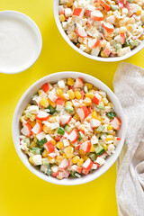 Salad with crab sticks, corn, eggs, cucumber and rice
