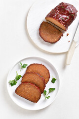 Sliced meatloaf on plate