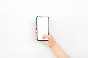 a hand holding a cellphone with an empty screen. a smartphone with a blank white screen used for advertising mockup.
