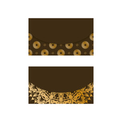 Business card in brown color with mandala gold pattern for your personality.