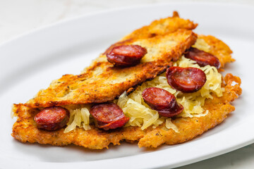 potato pancake filled with cabbage and sausage