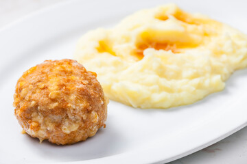 meat ball with cheese served with mashed potatoes