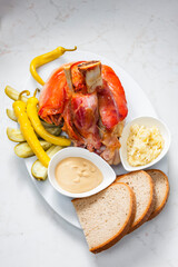 roasted pork knee with picked vegetables, bread and mustard
