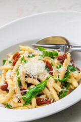 pasta with dry tomatoes and spinach