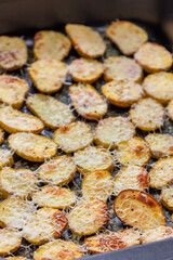 slices of potatoes baked with grated cheese