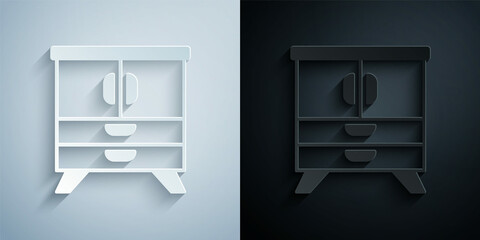 Paper cut Chest of drawers icon isolated on grey and black background. Paper art style. Vector