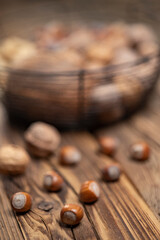 different kinds of nuts on a wooden background
