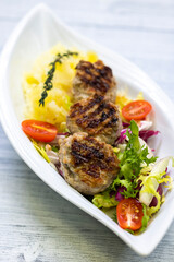 minced veal steaks with mashed potatoes and salad
