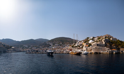 Fototapeta premium view from the sea to the Hydra marina sea port, Greece
