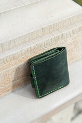 Fototapeta na wymiar hand made leather wallet . Leather craft. Selective focus