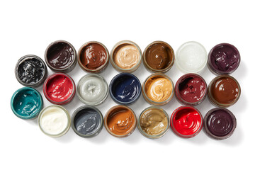 High angle view of cans of colored shoe polish