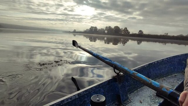 A rowboat ride on a foggy morning
