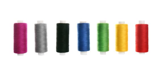 Set of colorful sewing threads on white background