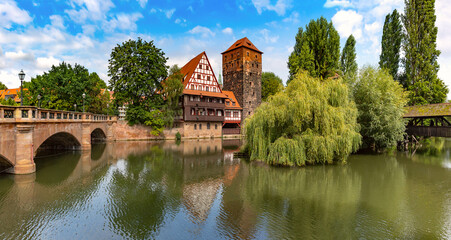 Naklejka na ściany i meble Pegnitz river waterfront with Weinstadel and Henkerhaus in Old Town of Nuremberg, Bavaria, Germany
