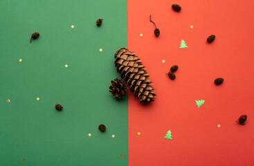 Christmas composition with cones, stars and little Christmas trees on a bright background