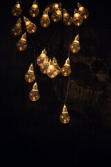 Christmas garland with yellow lights in the dark