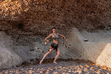 Cabo de Gata, Almeria, Spain. Female performer with fire fans on the beach rehearsing her performance.