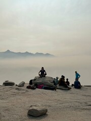 Yoga pose on top of Half Dome in Yosemite National Park
