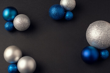Christmas balls of a different color on a dark background