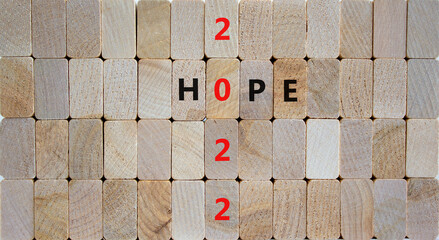 2022 hope new year symbol. Wooden blocks with words 'Hope 2022'. Beautiful wooden background, copy space. Business, 2022 hope new year concept.